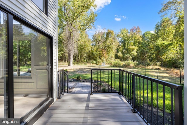 wooden terrace with a yard