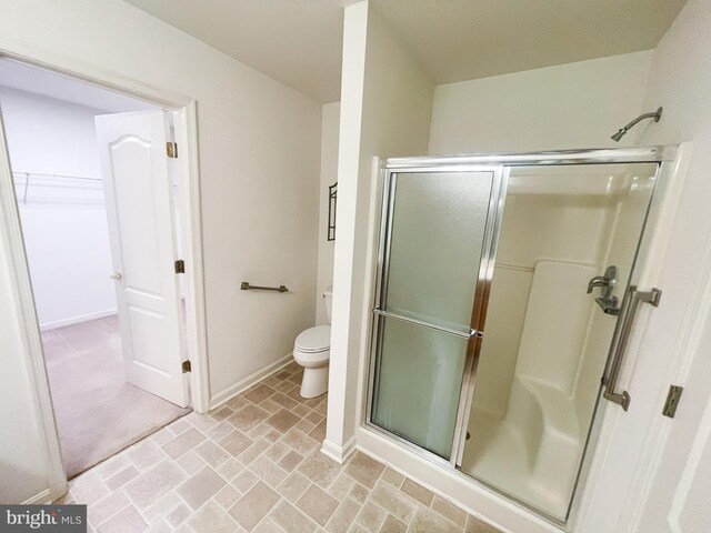 bathroom with walk in shower and toilet