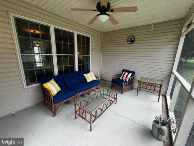 back of property featuring a sunroom and a yard