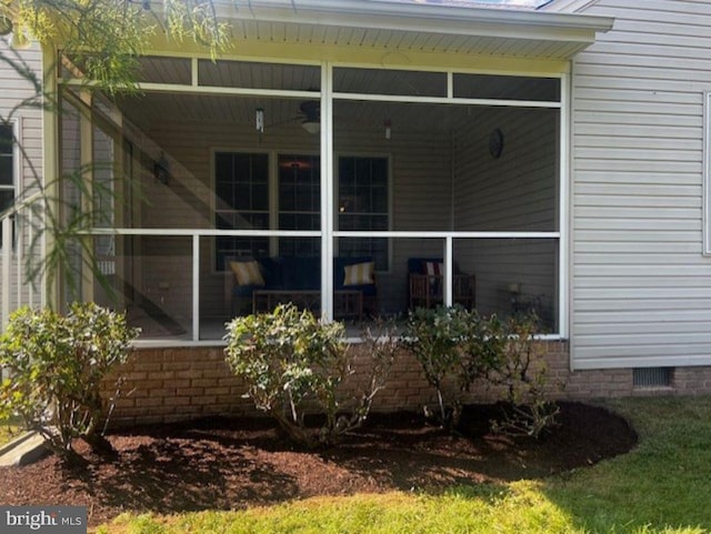 view of side of home with a sunroom