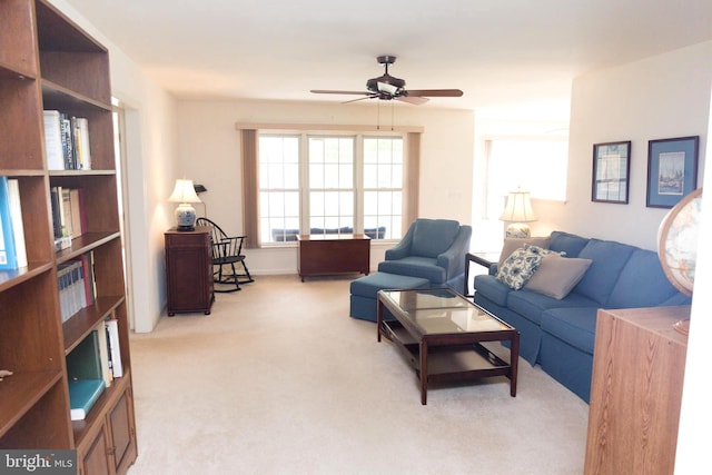 living room featuring ceiling fan and light colored carpet