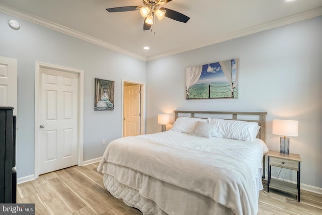 bedroom featuring ornamental molding, ceiling fan, and light hardwood / wood-style floors