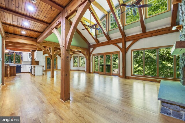 unfurnished living room with a healthy amount of sunlight, ceiling fan, and light hardwood / wood-style floors