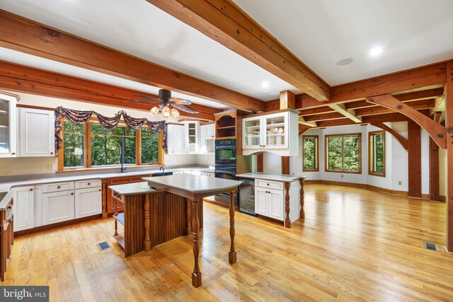 kitchen with plenty of natural light, a center island, and a breakfast bar