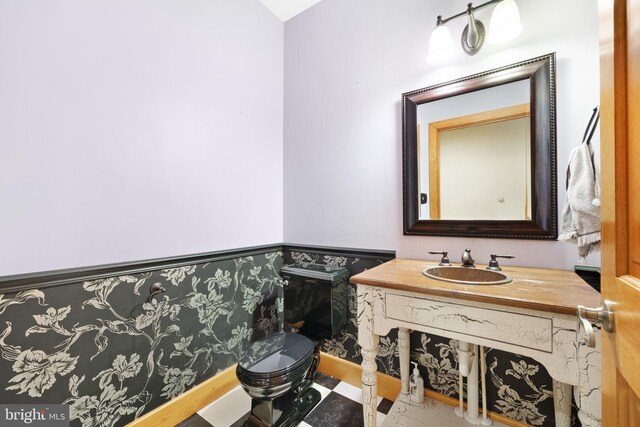 bathroom with vanity and toilet