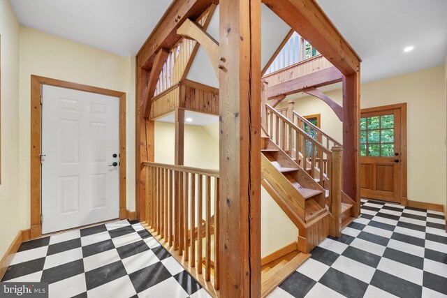 entryway featuring vaulted ceiling