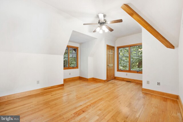 bonus room featuring vaulted ceiling, a healthy amount of sunlight, light hardwood / wood-style flooring, and ceiling fan