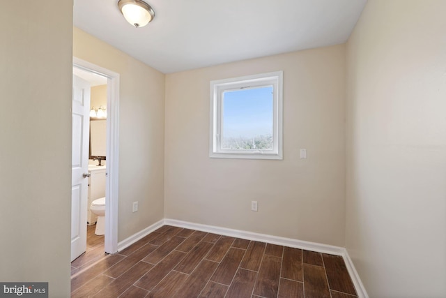 unfurnished room with dark hardwood / wood-style floors