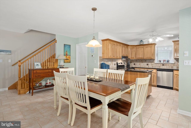 dining space featuring ceiling fan