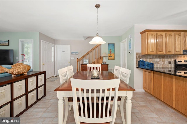 dining room with stairs