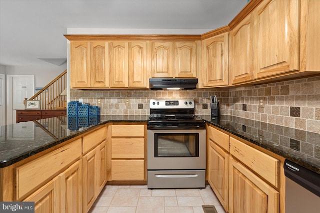 kitchen with tasteful backsplash, ventilation hood, dark stone counters, appliances with stainless steel finishes, and light tile patterned flooring