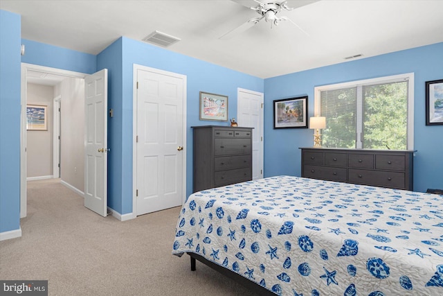 bedroom featuring a ceiling fan, carpet flooring, baseboards, and visible vents