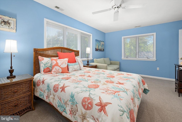 bedroom featuring visible vents, baseboards, carpet floors, and a ceiling fan