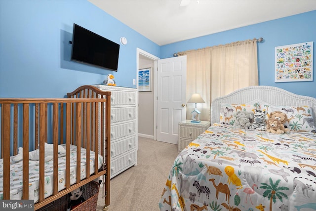 carpeted bedroom featuring baseboards