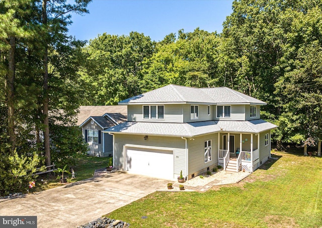 view of front of home with a garage, covered porch, and a front lawn