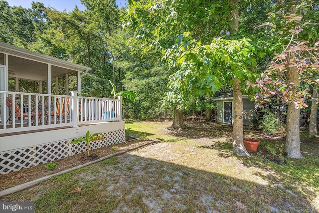 view of yard with a deck