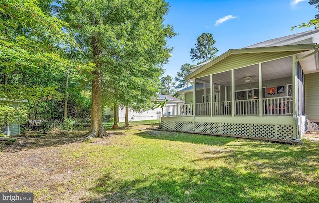 view of yard featuring a sunroom