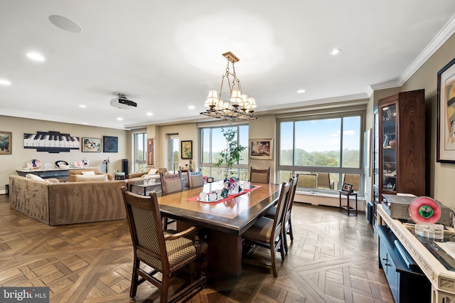 dining area featuring an inviting chandelier, ornamental molding, and recessed lighting