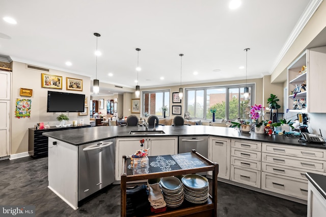 kitchen with pendant lighting, crown molding, and sink