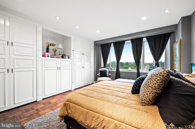 bedroom with dark parquet flooring