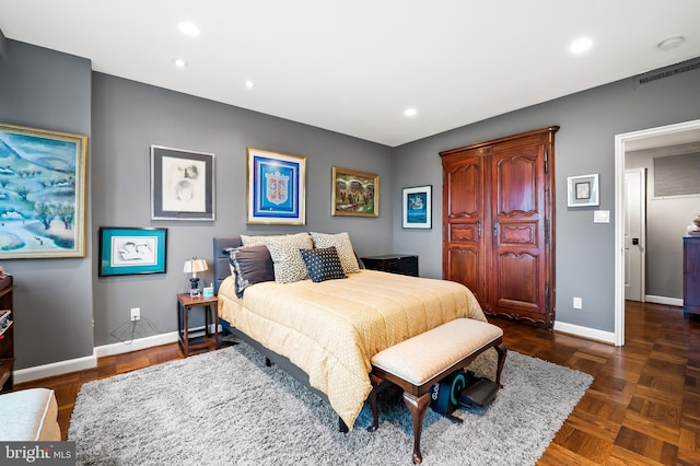 bedroom with dark parquet flooring