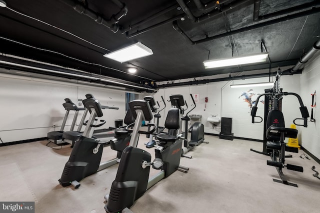 exercise room with concrete floors