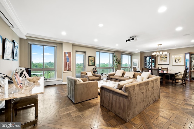 living room featuring a notable chandelier, ornamental molding, and dark parquet flooring