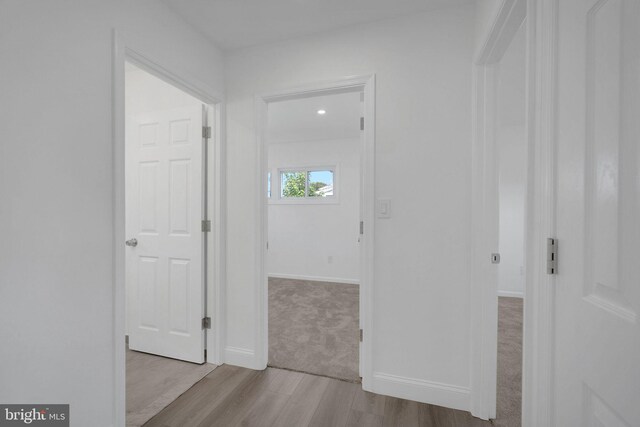 hallway featuring light wood-type flooring