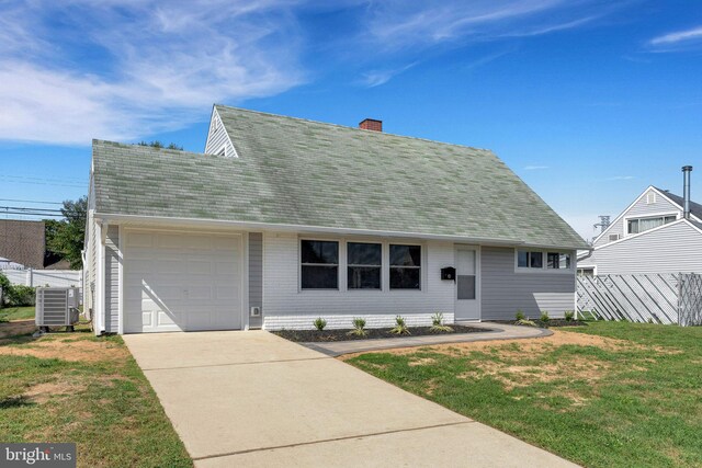 new england style home with a front yard, a garage, and central AC