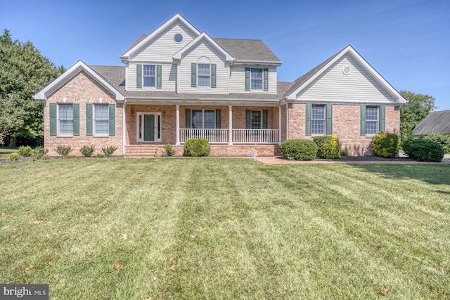 view of front of house with a front lawn and covered porch