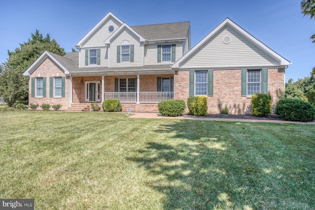 front facade with a front yard and a porch