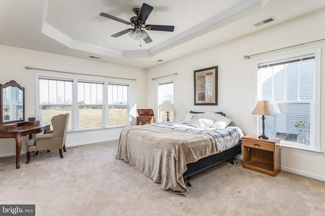 carpeted bedroom featuring ceiling fan and multiple windows