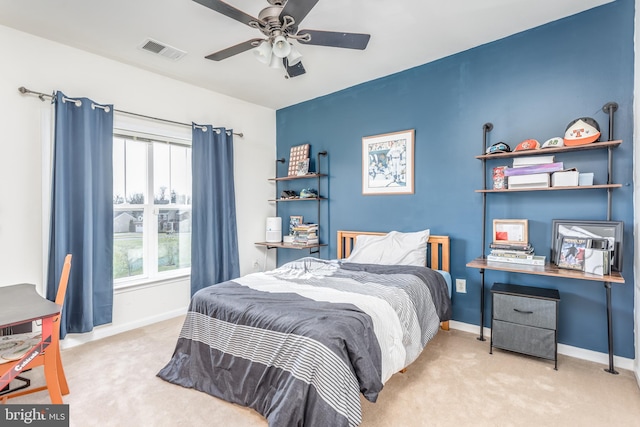 bedroom featuring ceiling fan and light colored carpet