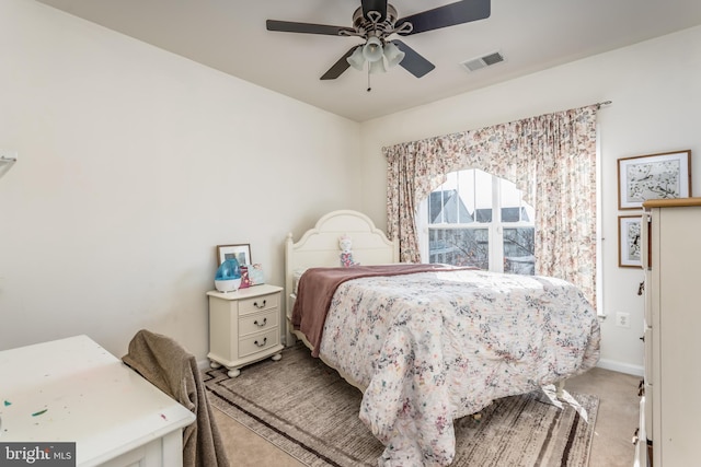 carpeted bedroom featuring ceiling fan