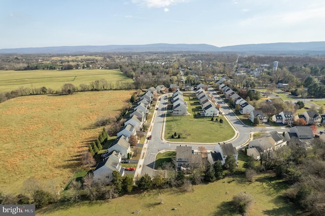 birds eye view of property with a mountain view