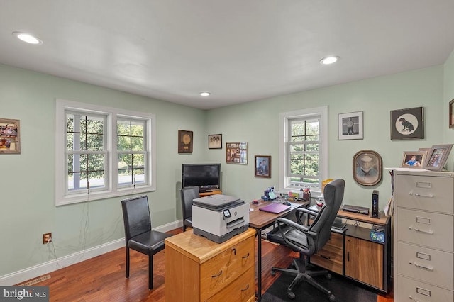 office with dark wood-type flooring