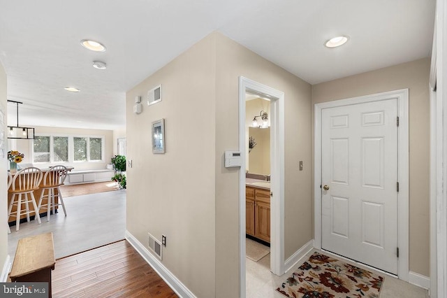 foyer entrance featuring light hardwood / wood-style flooring