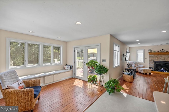 interior space featuring a fireplace, plenty of natural light, and light hardwood / wood-style floors