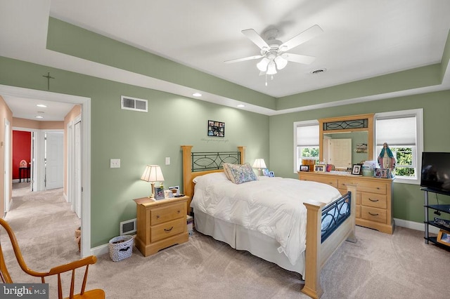 bedroom featuring ceiling fan and light colored carpet