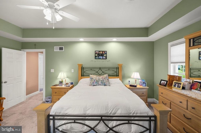 bedroom featuring light colored carpet and ceiling fan