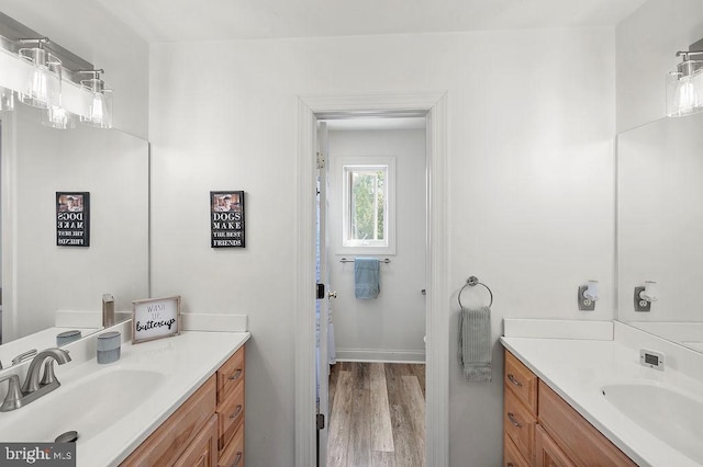 bathroom featuring hardwood / wood-style flooring and vanity