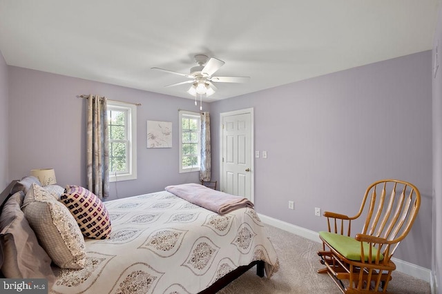 bedroom featuring ceiling fan and carpet