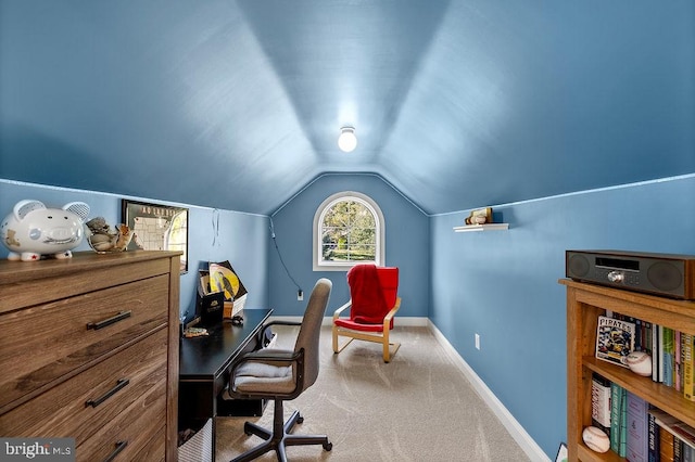 office area with carpet and vaulted ceiling