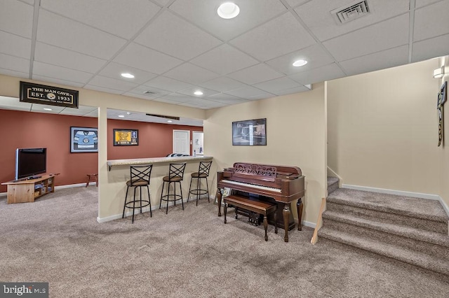 bar with carpet and a drop ceiling