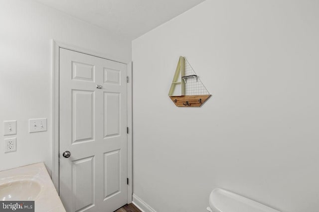 bathroom featuring toilet and vanity