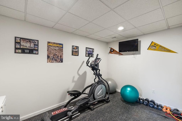 exercise area featuring a paneled ceiling