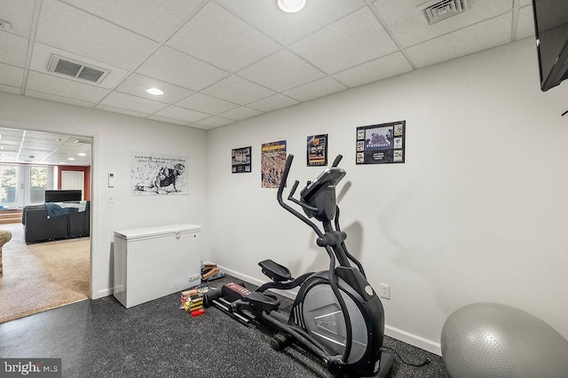 exercise room with a drop ceiling