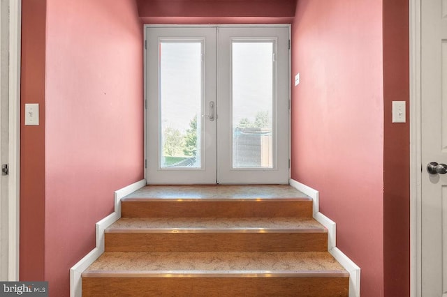 staircase featuring french doors