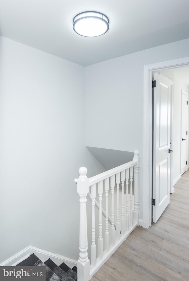 stairway with wood-type flooring