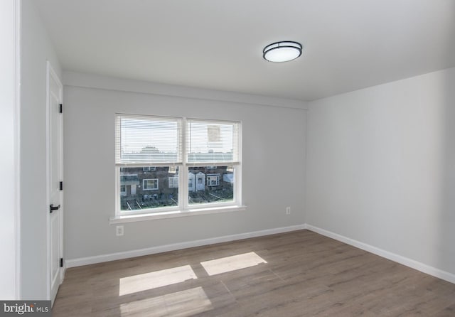 unfurnished room featuring light hardwood / wood-style flooring